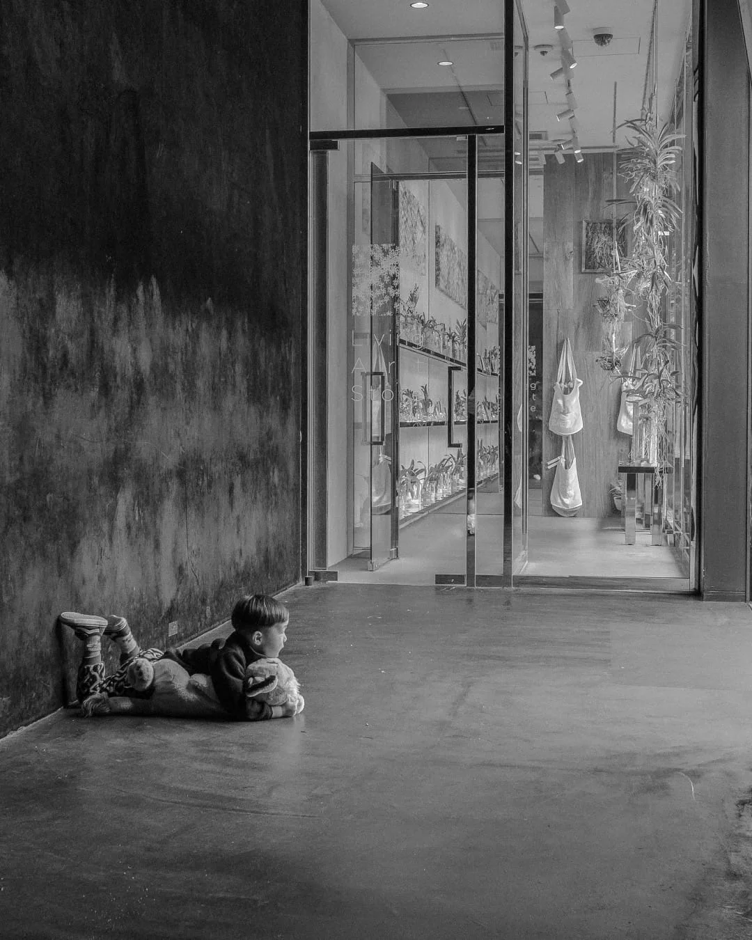Kiddo watching the clouds go by, probably after peeing in the waterfall exhibit at Teamlab Planets.
